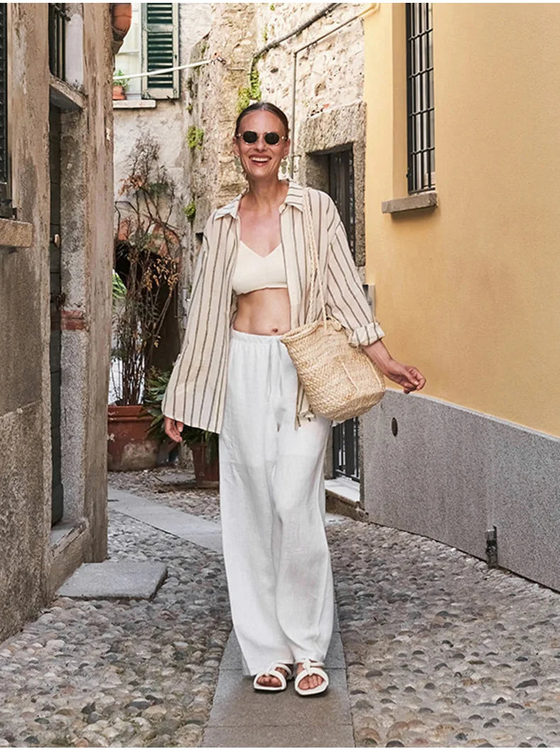 Knit wide-leg drawstring trousers for women by Christine Brewer, featuring a relaxed fit and pull-on design.