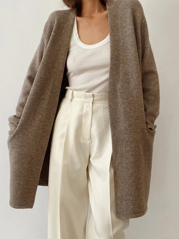 Women’s Jacqueline Merino Wool Cardigan by Christine Brewer, featuring a cozy knit design in a neutral color.