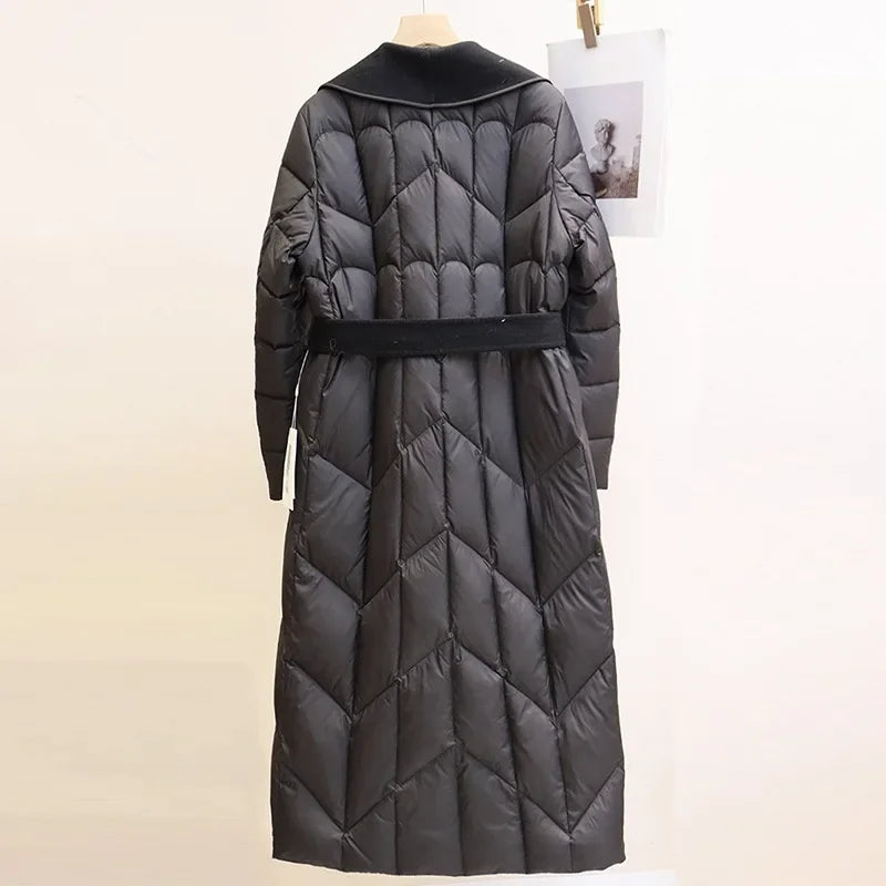 Christine Brewer Lily long belted puffer jacket for women, featuring a stylish quilted design and a waist belt for a flattering fit.