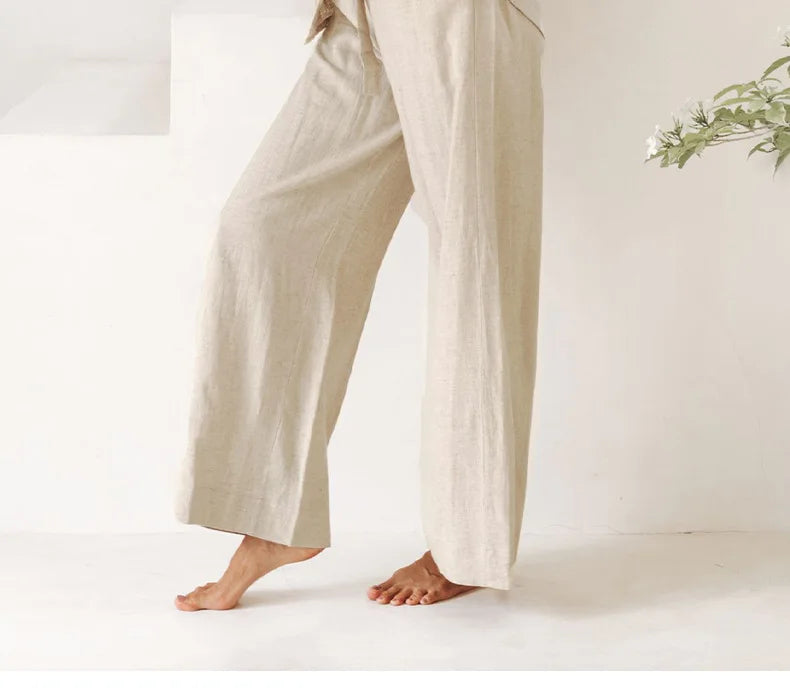 Women’s linen wide-leg trousers by Christine Brewer, loose pull-on pants with relaxed fit and casual style.