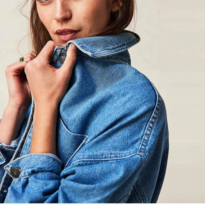 Charlotte oversized denim shirt jacket for women by Christine Brewer, shown in classic blue denim with a relaxed fit.