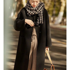Green long wool coat for women from Christine Brewer, featuring a stylish and warm design with a classic fit.