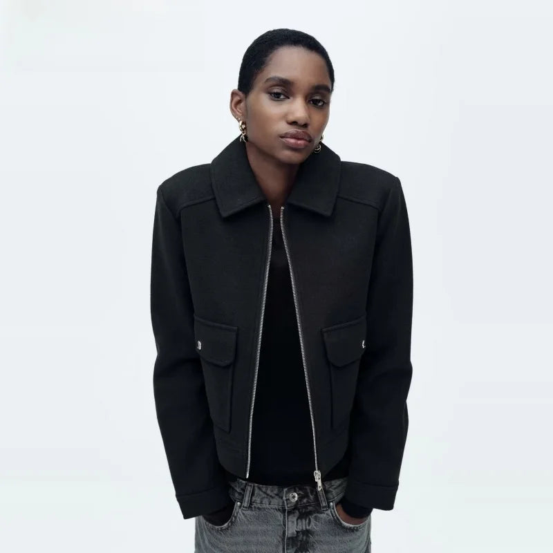 Women’s Isla cropped zip-up utility jacket by Christine Brewer, shown in dark green with multiple utility pockets and a front zipper.