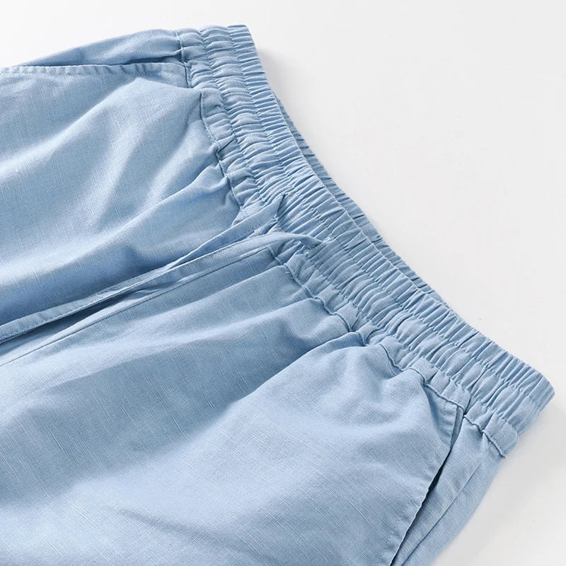 Women’s cotton linen wide-leg drawstring trousers by Christine Brewer, loose pull-on pants with relaxed fit and comfortable style.