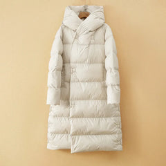 Women’s long hooded parka by Christine Brewer, featuring a stylish design with a hood and warm, comfortable fit.