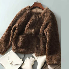 Emily glamorous faux fur coat for women by Christine Brewer, shown in a stylish, plush faux fur fabric with a cozy design.