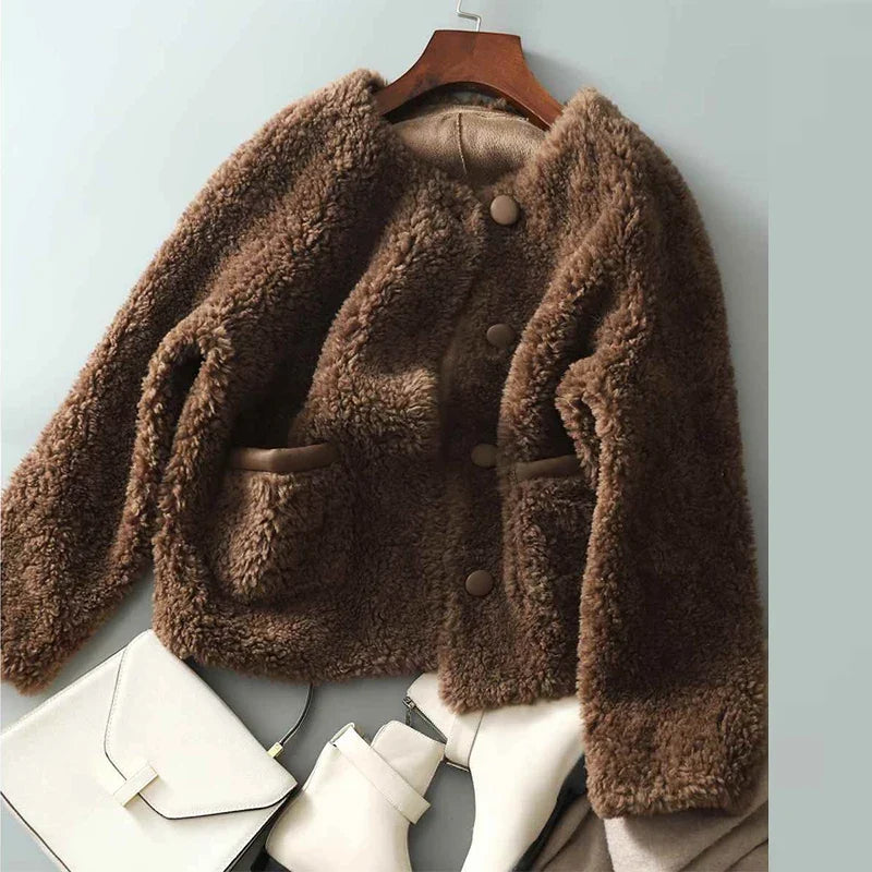 Emily glamorous faux fur coat for women by Christine Brewer, shown in a stylish, plush faux fur fabric with a cozy design.