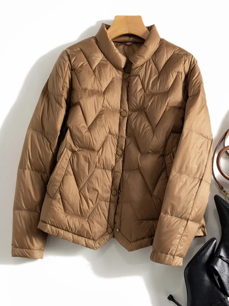 Christine Brewer Aurora short quilted puffer jacket for women, lightweight and warm with a stylish quilted design.