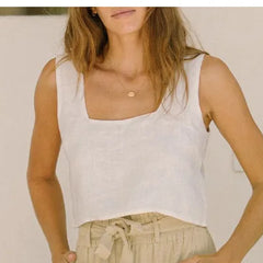Women’s linen wide-leg trousers by Christine Brewer, loose pull-on pants with a relaxed fit, shown in a neutral color.