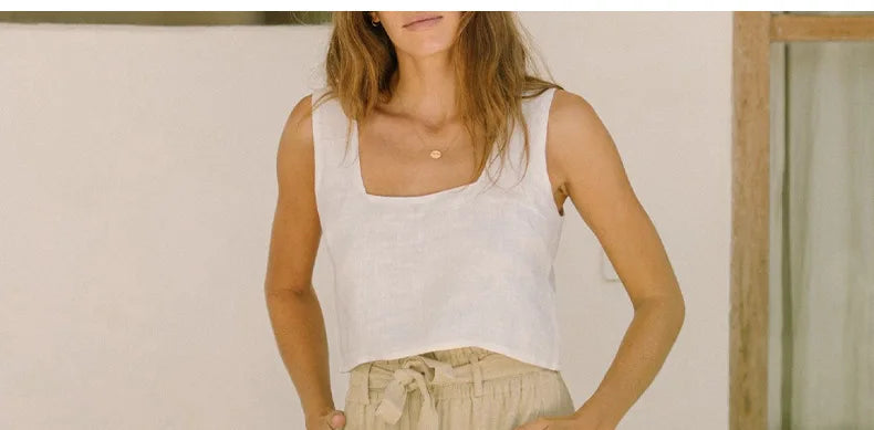 Women’s linen wide-leg trousers by Christine Brewer, loose pull-on pants with a relaxed fit, shown in a neutral color.
