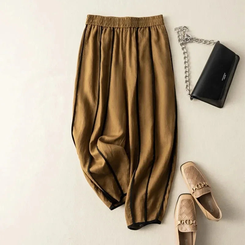 Women’s linen wide-leg elastic-waist trousers by Christine Brewer, loose pull-on pants with relaxed fit and breathable fabric.