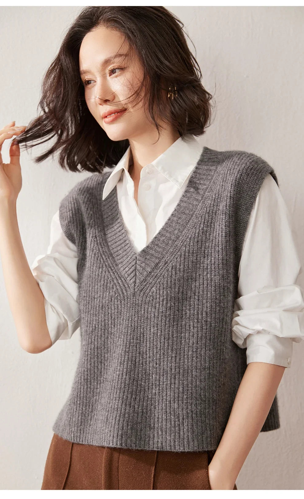 Cashmere ribbed knit sweater vest for women by Christine Brewer, featuring a close-up of the textured fabric and classic design.