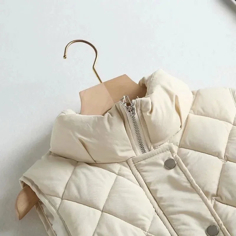 Ruby stand collar puffer vest for women by Christine Brewer, featuring a sleek design and quilted texture in vibrant ruby color.