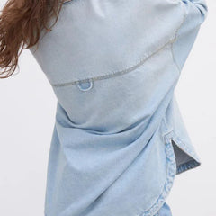 Women’s relaxed denim shirt jacket by Christine Brewer, featuring classic blue denim, button front, and casual fit.