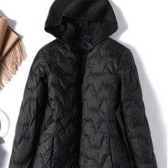 Women’s quilted puffer jacket with hood by Christine Brewer, featuring a sleek quilted design and cozy insulation.