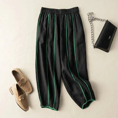 Women’s linen wide-leg elastic-waist trousers by Christine Brewer, loose pull-on pants with relaxed fit and comfortable style.