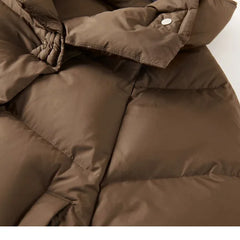 Women's cropped quilted parka by Christine Brewer, featuring a stylish, insulated design with a high collar and quilted pattern.