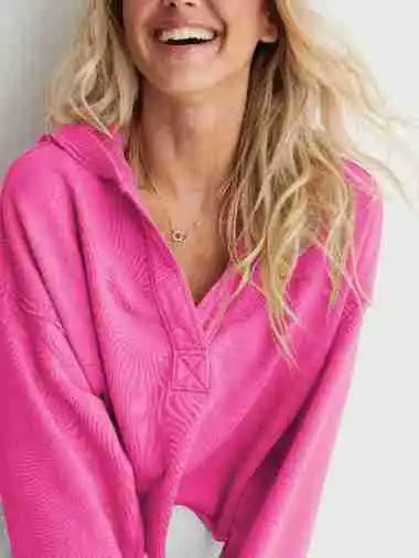 Pink Eleanor cropped hoodie for women by Christine Brewer, featuring a relaxed fit and soft fabric, shown on a model.