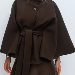 Emma belted cape coat for women by Christine Brewer, shown in a stylish, draped design with a belt at the waist.