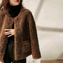 Elegant Emily faux fur coat for women by Christine Brewer, showcasing plush beige faux fur with wide collar and stylish design.