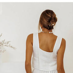Light beige linen wide-leg trousers for women, loose pull-on pants by Christine Brewer, shown on a model.
