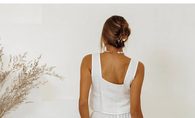 Light beige linen wide-leg trousers for women, loose pull-on pants by Christine Brewer, shown on a model.