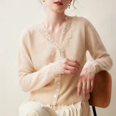 Elsa cashmere cardigan for women by Christine Brewer, soft cream-colored knit sweater with button front and long sleeves.