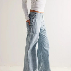 Blue denim wide-leg women's jeans by Christine Brewer, relaxed fit pants with a casual, stylish look.