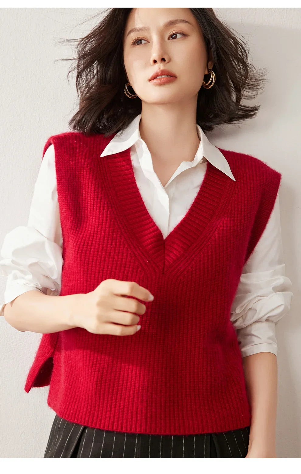 Cashmere ribbed knit sweater vest for women by Christine Brewer, featuring a stylish, cozy design with a V-neck and ribbed texture.