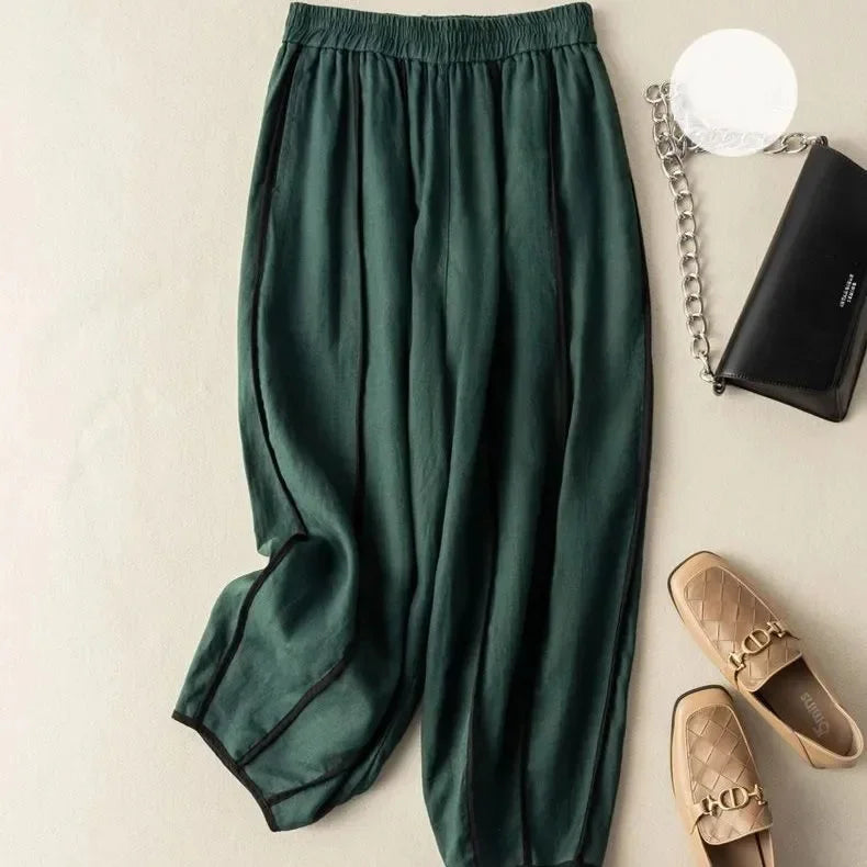 Women’s linen wide-leg elastic-waist trousers by Christine Brewer, featuring loose pull-on style and comfortable fit.