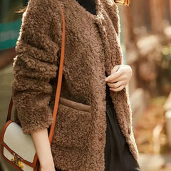 Glamorous faux fur coat for women by Christine Brewer, featuring a plush, stylish design perfect for cold weather.