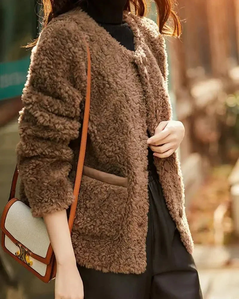 Glamorous faux fur coat for women by Christine Brewer, featuring a plush, stylish design perfect for cold weather.