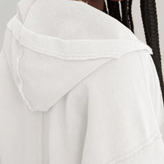 Pink cropped hoodie for women by Christine Brewer, featuring a relaxed fit and soft fabric, shown on a model.