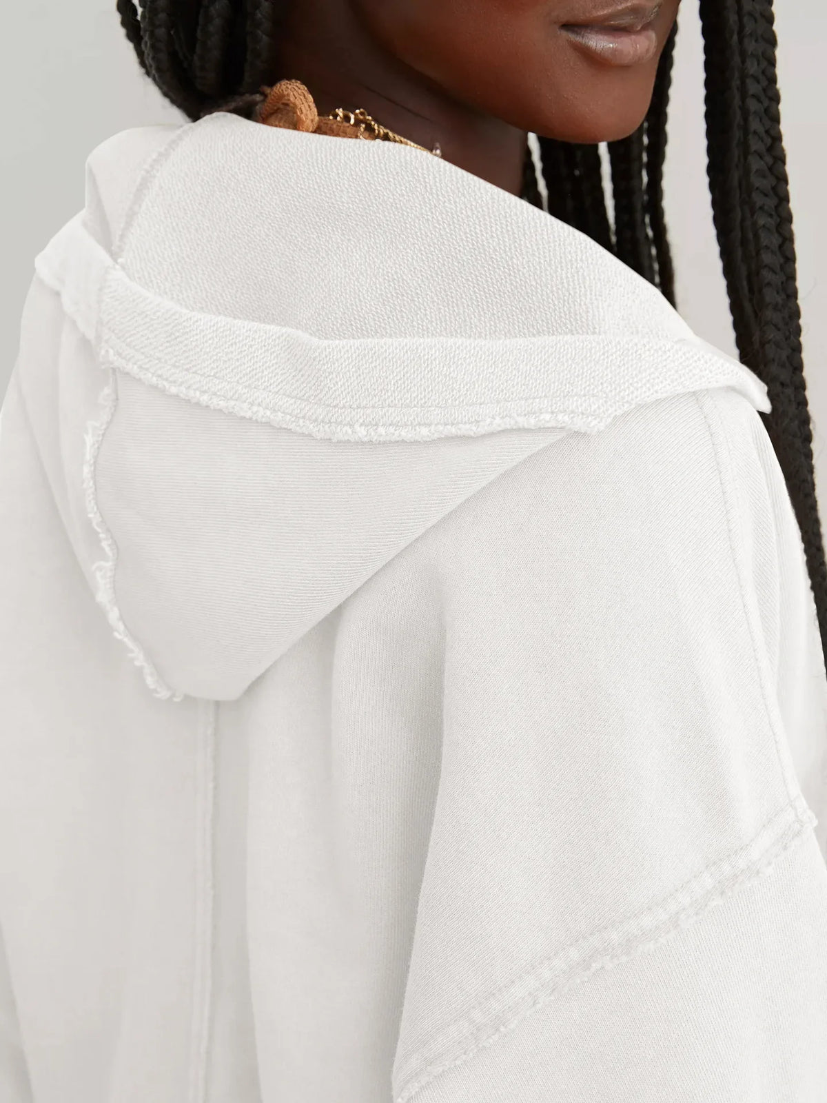 Pink cropped hoodie for women by Christine Brewer, featuring a relaxed fit and soft fabric, shown on a model.