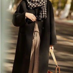 Green long wool coat for women, the Lucy by Christine Brewer, shown on a model with a stylish, tailored fit.