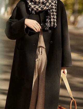Green long wool coat for women, the Lucy by Christine Brewer, shown on a model with a stylish, tailored fit.