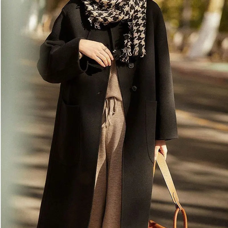 Green long wool coat for women, the Lucy by Christine Brewer, shown on a model with a stylish, tailored fit.