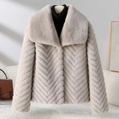 Women’s short faux fur coat by Christine Brewer, featuring plush texture and cozy style, perfect for winter wear.