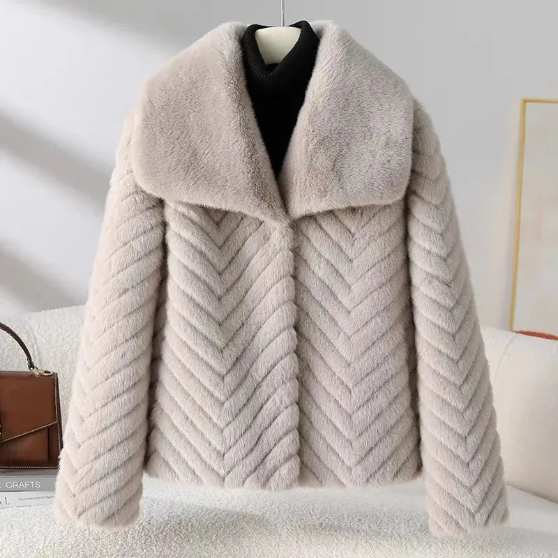 Women’s short faux fur coat by Christine Brewer, featuring plush texture and cozy style, perfect for winter wear.