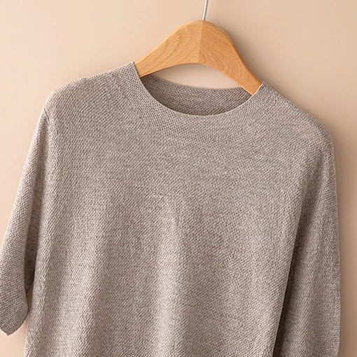Cream-colored wool sweater for women by Christine Brewer, featuring a cozy fit and classic design.