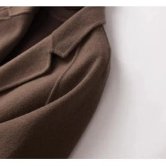 Brown double-breasted wool coat for women by Christine Brewer, featuring classic design and tailored fit