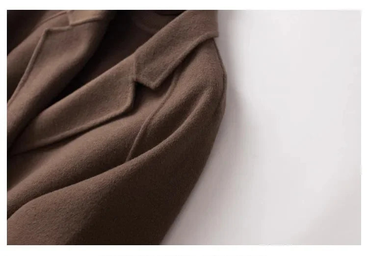 Brown double-breasted wool coat for women by Christine Brewer, featuring classic design and tailored fit