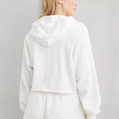 Eleanor cropped hoodie for women by Christine Brewer, shown in a casual fit with long sleeves and a soft fabric texture.