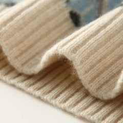 Christine Brewer Jolene cashmere mock neck sweater for women, soft beige knit with long sleeves and a fitted silhouette.