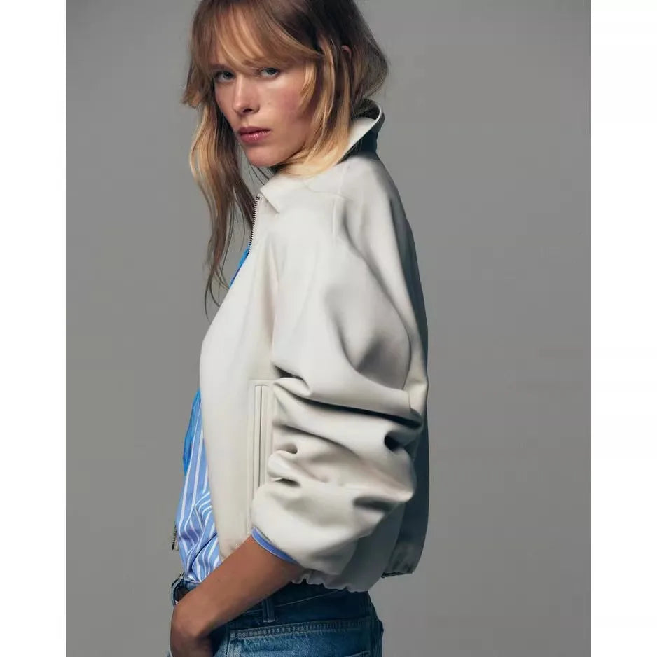 Violet zip-up puffer jacket for women by Christine Brewer, featuring a quilted design and high collar for warmth and style.