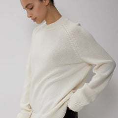 Oversized wool sweater for women by Christine Brewer featuring a cozy, chunky knit in soft, neutral tones.