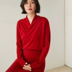 Woman wearing a cream-colored Christine Brewer Dawn cashmere sweater, showcasing its soft knit and cozy fit.
