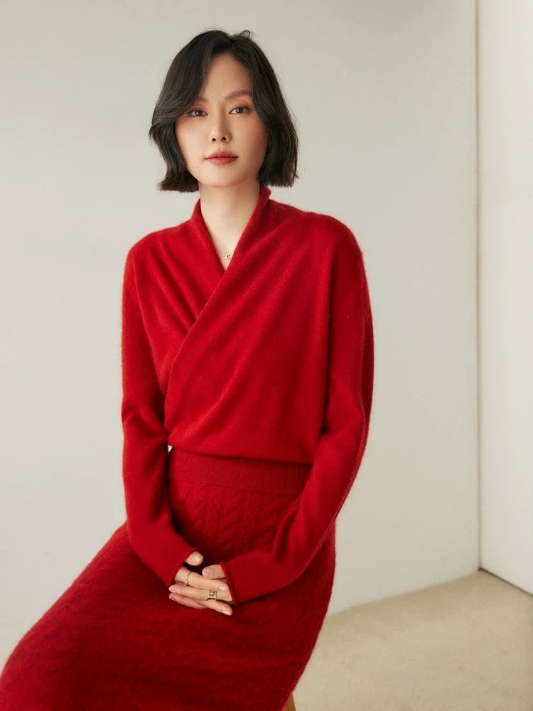 Woman wearing a cream-colored Christine Brewer Dawn cashmere sweater, showcasing its soft knit and cozy fit.