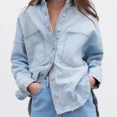 Women’s relaxed denim shirt jacket by Christine Brewer, featuring a casual fit and classic blue denim fabric.