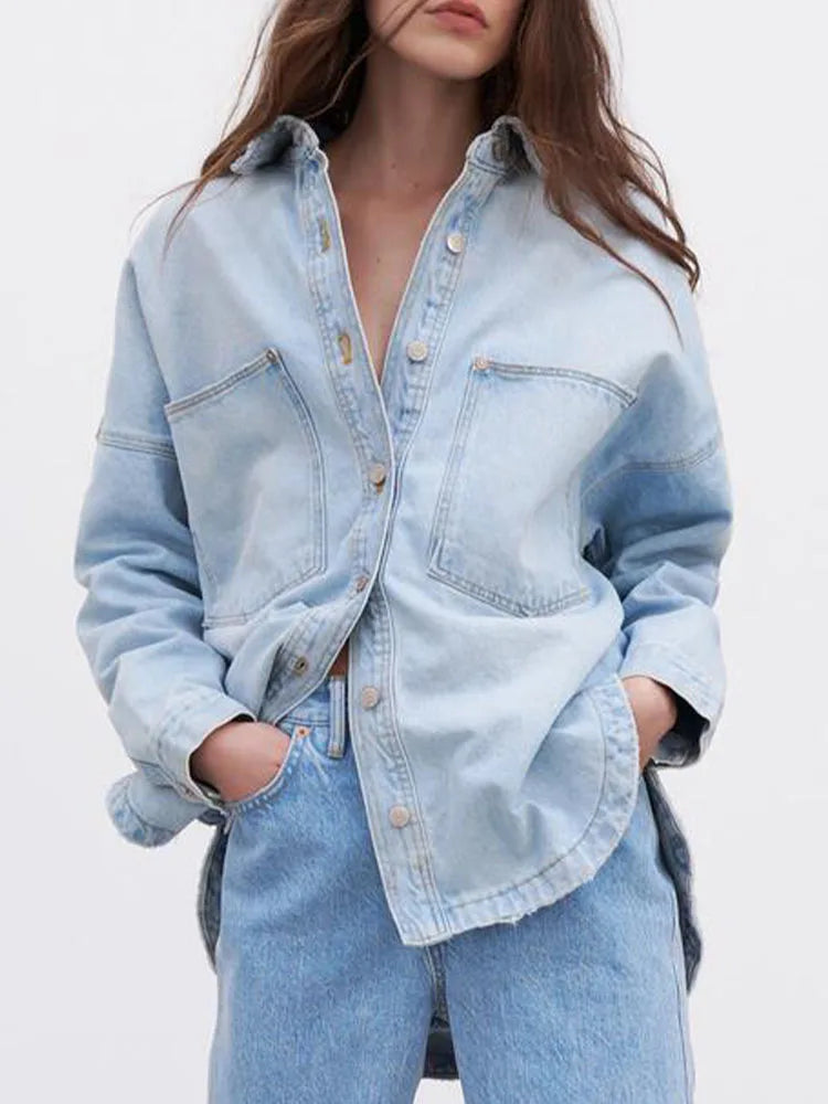 Women’s relaxed denim shirt jacket by Christine Brewer, featuring a casual fit and classic blue denim fabric.